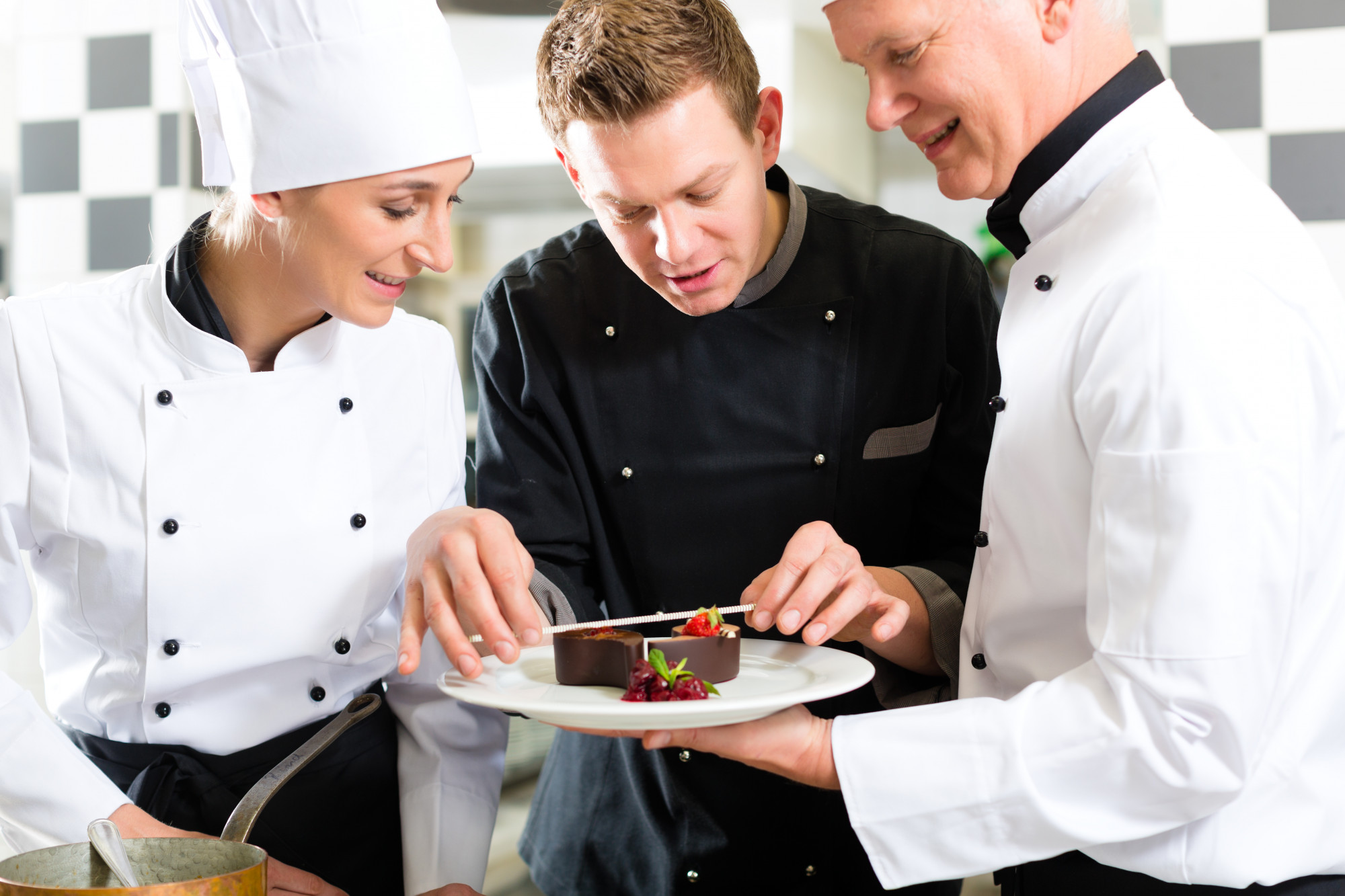 Students plating food in a workshop